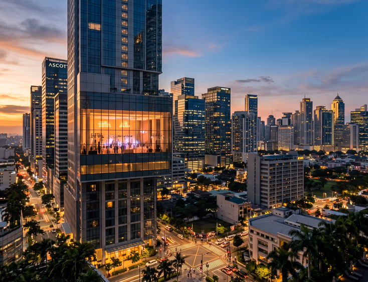 Wide landscape shot of the Metro Manila skyline at golden hour, showcasing luxury hotel event venues in BGC and Makati skyscrapers.