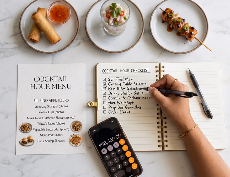 Overhead flat lay of Filipino wedding cocktail hour planning materials with a printed menu, handwritten checklist, calculator, and sample plates of lumpiang shanghai, kinilaw, and chicken barbecue skewer on a marble surface