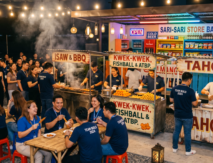 Filipino company street food festival team building event. Employees gather around food carts under warm evening string lights.