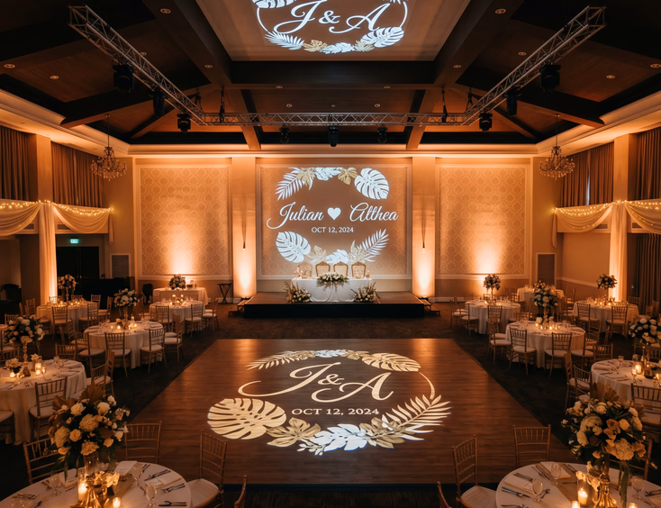 Filipino wedding reception venue showing three gobo monogram projections on dance floor, feature wall behind couple's table, and ceiling above dance floor