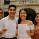Young Filipino couple celebrating outside a city hall after a civil wedding