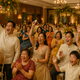 Guests enjoying fun indoor wedding games at a festive Philippine wedding reception.