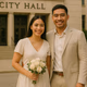 Young Filipino couple in civil wedding attire outside City Hall